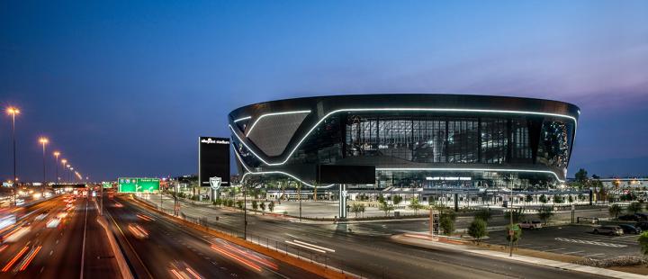 Allegiant Stadium in Las Vegas, Nevada, next to a busy highway.