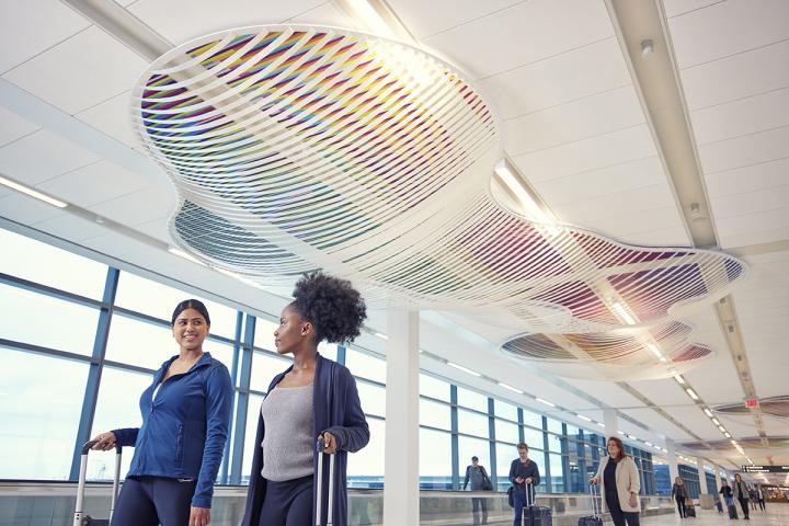 Multi-colored ceiling art simulating clouds.