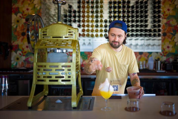 Jay Sanders topping a cocktail.
