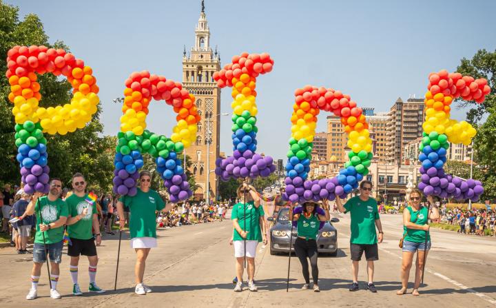 Rainbow-colored balloons spelling out PRIDE
