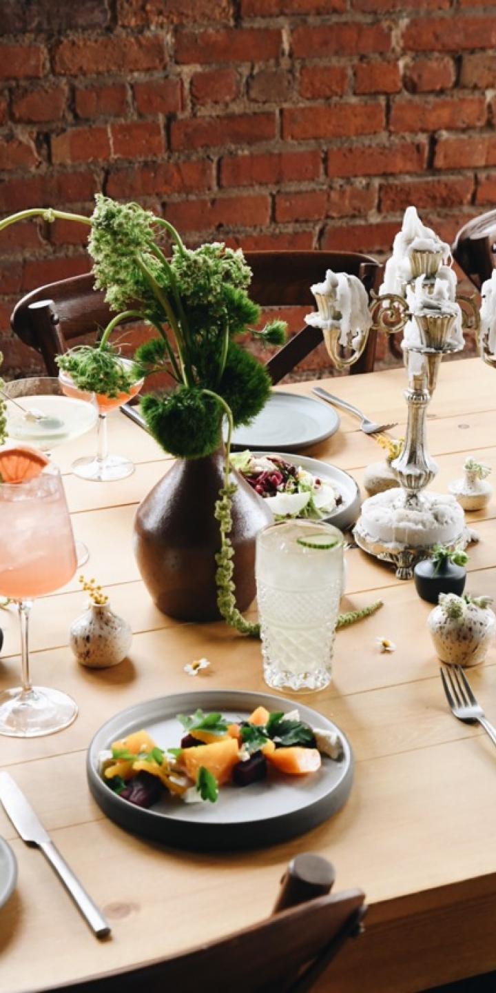 Rustic table setting with organic decorations and a variety of food