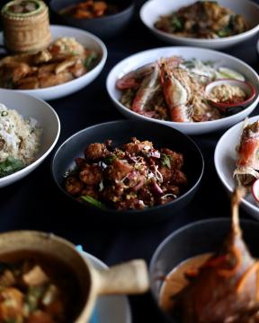A spread of Thai food in bowls.