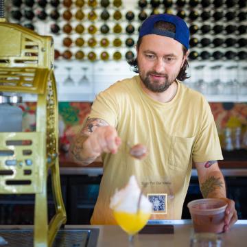 Jay Sanders topping a cocktail