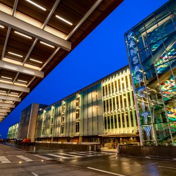 KCI Airport parking garage, with a lighted sign reading Kansas City.